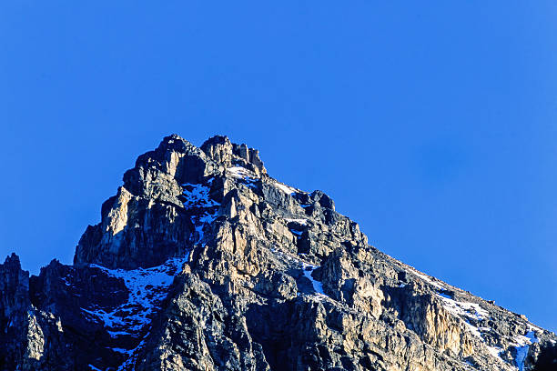 Rocky mountain peak at a blue sky
