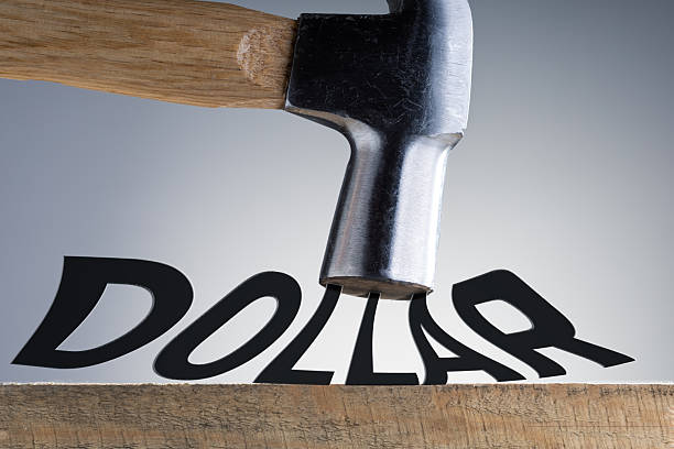 striking a dollar word, symbolizing financial crisis or dedollarisation on economic issues.