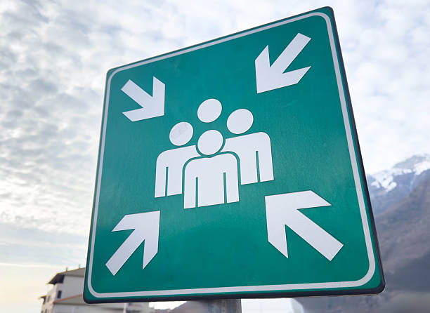 Emergency assembly point sign with group symbol