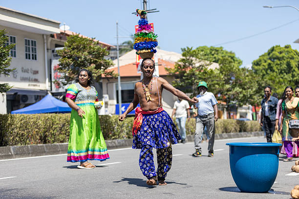 31 January 2026, George Town - Penang.Indian man carrying a small kavadi on his head and another Indian devotee are seen dancing during the Thaipusam festival.