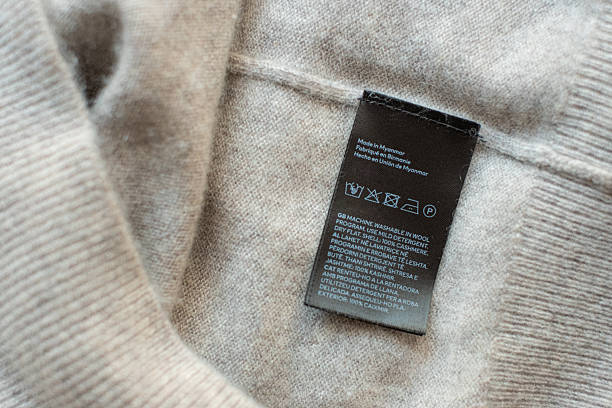 Beige cashmere sweater with care label