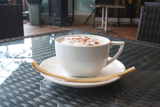 Delicious hot chocolate topped with marshmallows and wafer cookies for winter holidays