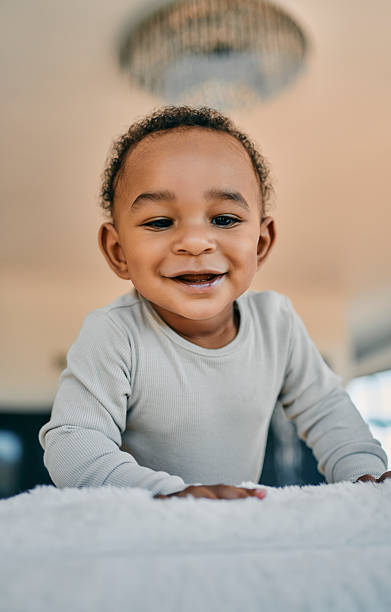 istock Smiling Baby Playing Indoors 2259254313