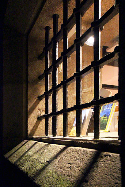 Ancient carved cast iron railing, window, stone facade, Santiago de Compostela, Camino de Santiago, Galicia, Spain.