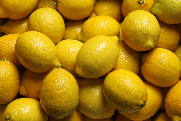 istock Fresh lemons as background, closeup. Citrus fruit 2259280718