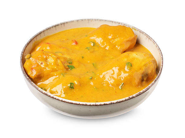 Tasty fresh chicken curry isolated on white