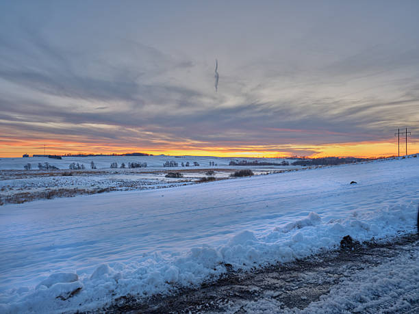 Traditional windmills in the countryside from the Netherlands in winter at sunset