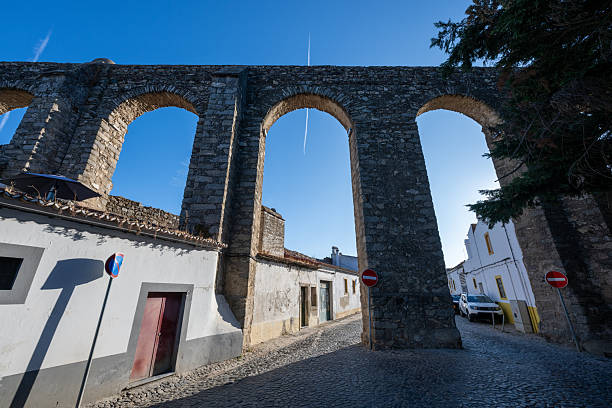 Agua de Prata Aqueduct, Aqueduct of Silver Water in Evora, Portugal. Its arches stretching for 9 kilometres , this aqueduct was built in 1531-1537 by King Joao III to supply the city with water.