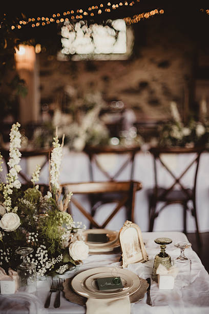 istock Wedding reception table setting with flowers, greenery and place cards 2259319376