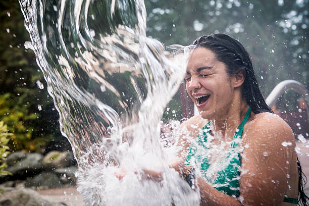 Young woman enjoys spa cool plunge at luxury resort, Whistler, B.C.