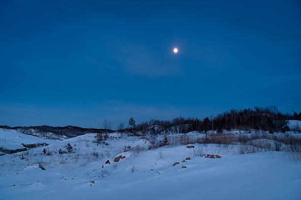 Coal mining at an open pit. Coal mine in winter covered with snow. Russia