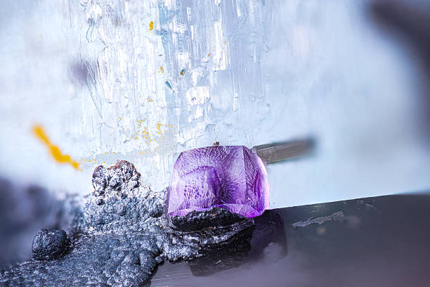 Purple Fluorite on black Schorl and blue Aquamarine. Specimen from Erongo Complex, Namibia Micro photography extreme close-up. microscope mineral crystal photography for Scientific use.