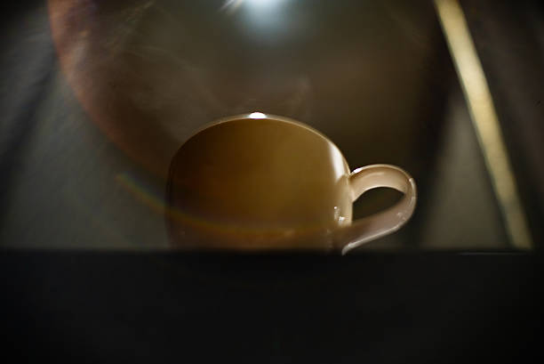 Fluffy coffee mug on brown and soft balloon surface.