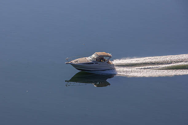 boat sailing at full speed through calm waters
