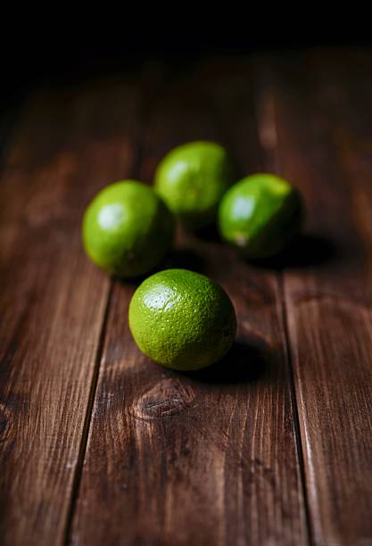 Limes on wooden table