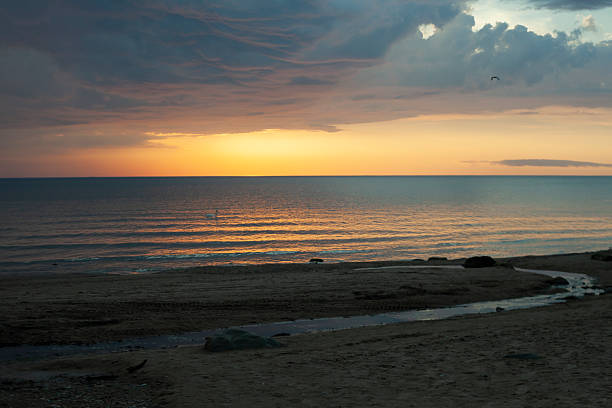 View of the Baltic sea coast with small river.