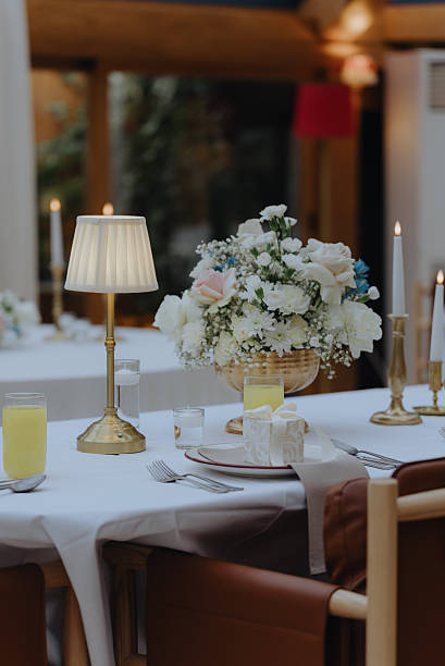 Elegant wedding reception table setting with floral centerpiece