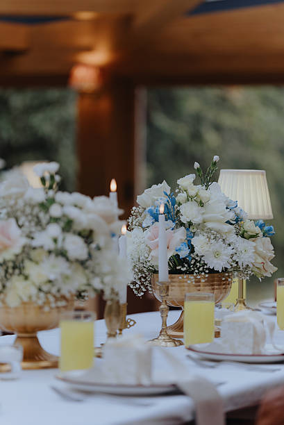 Elegant wedding table setting with flowers, candles, dessert