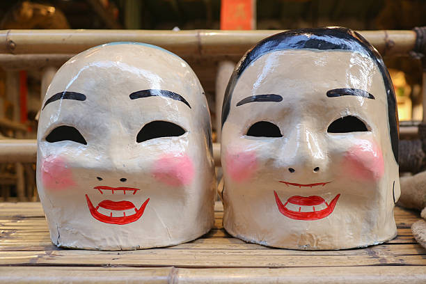 Quang Nam province, Vietnam - 13 Jul 2024: artisan making handmade antique masks in Hoi An ancient town, Quang Nam, Vietnam