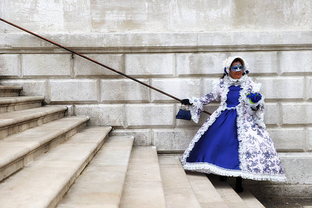 Venice, VE, Italy - February 13, 2024: Person with Mask with many mirrors at the Venice Carnival