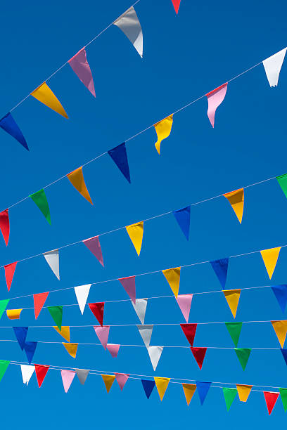 Colorful prayer flags on blue sky. traditional carnival decorative.