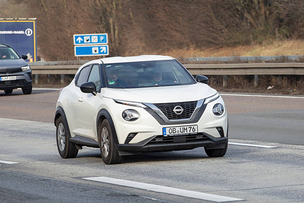 Medenbach, Germany - January 22, 2026: A Nissan car on German highway A3 nearby Wiesbaden in Germany. Nissan Motor Company Ltd is a multinational car manufacturer founded in 1933 and headquartered in Japan