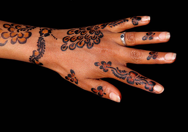 Morocco. Unknown woman's hand intricately painted - tattooed with henna.