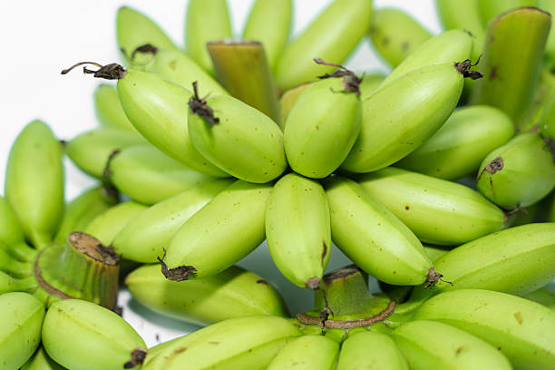 Green banana on green background.