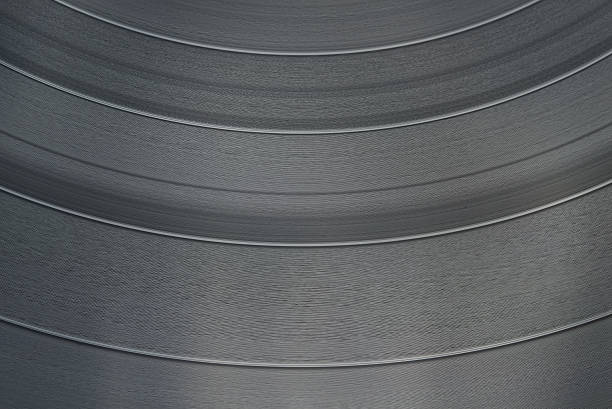 closeup of a vinyl record tracks making a seamless background