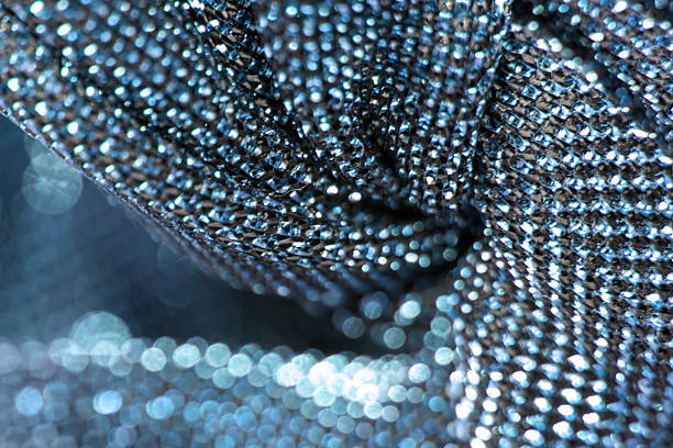 Metallic colors, bokeh, shimmering background. Shimmering fabric close-up. Unfocused