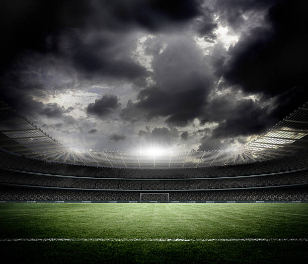 istock Dramatic Football Stadium Under Stormy Sky with Bright Floodlights 2259413739