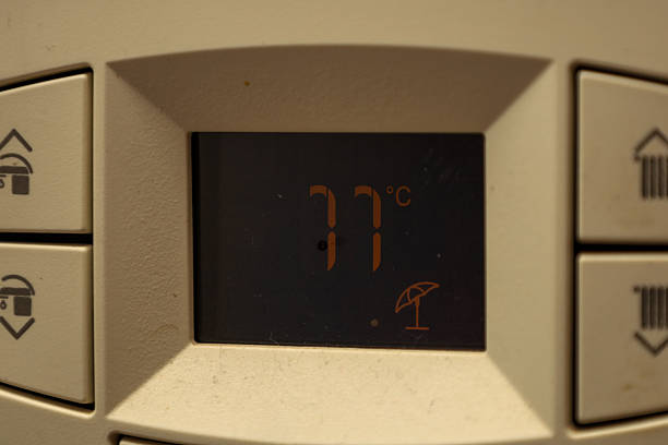 Closeup of heat cost allocator on central heating radiator. Gas usage meter and energy saving. Blokverwarming meter.