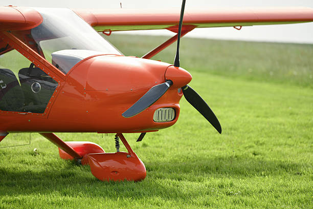 Red small gyrocopter at the airfield