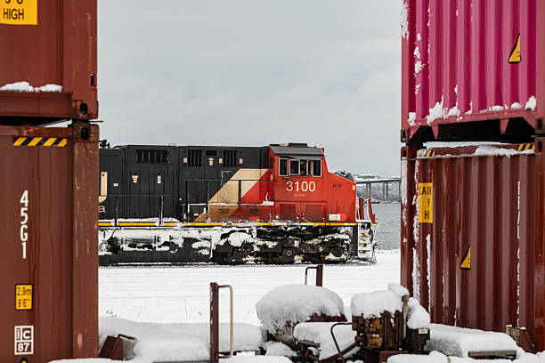 Halifax, NS, Canada - January 19, 2026 - CN Rail's diesel locomotive in the Pace Railyard after a heavy snowfall.