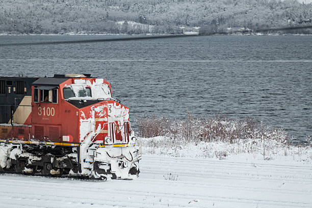 Halifax, NS, Canada - January 19, 2026 - CN Rail's diesel locomotive in the Pace Railyard after a heavy snowfall.