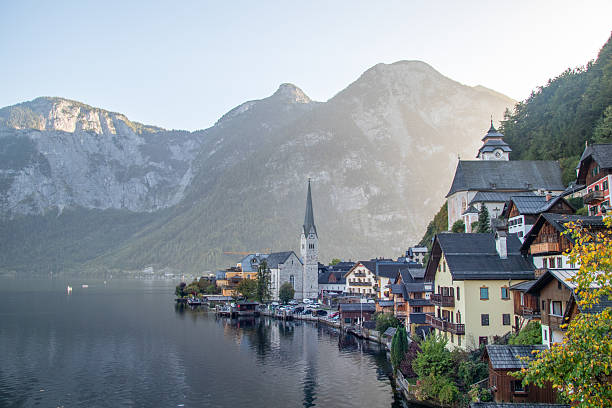 Hallstatt,Austria - October 11 2023:Stunning view of famous Hallstatt mountain village with Hallstatter lake. Popular travel destination in  Salzkammergut region in Austrian Alps.