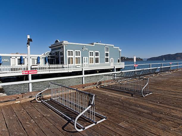 Sausalito, California - USA, October 21, 2025. Scoma's and boardwalk along the marina in Sausalito California. Sausalito on the Marin peninsula at the south end of Richardson Bay is across the San Francisco Bay from San Francisco California. A ship building center during World War II, became a wealthy artistic enclave with hillside residential districts.