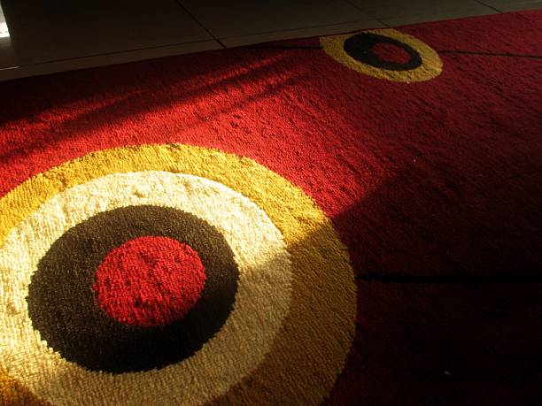 sunset shining on the carpet from the window