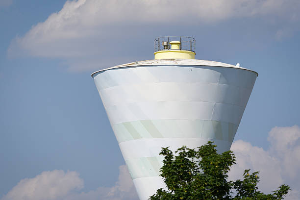 The tower is white and has the shape of a flying saucer. It is 62 metres high and holds 10,200 cubic metres  of water. The image shows the building partially from below.