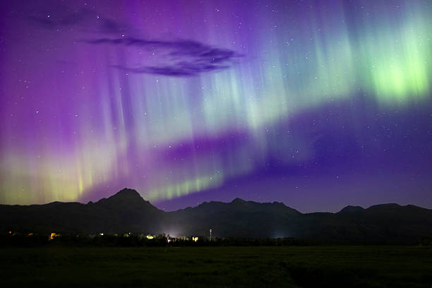 Beautiful landscape view of the northern lights over Kodiak Island in Alaska.