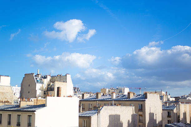 Paris, France: Rooftops in the 11th Arrondissement under Sunny Puffy Clouds