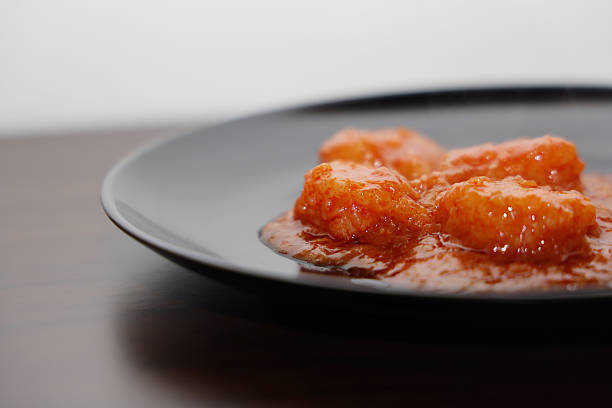 Close-up of chili shrimp on a wooden table