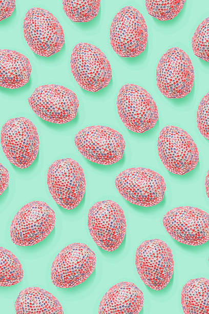 Ornate easter eggs in colorful sequins as minimal trend repeat pattern pastel mint color. Pop art still life photo with sparkling rhinestones pink eggs, spring easter holiday concept, modern design.