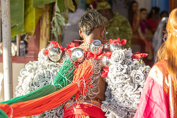 01 February 2026, George Town - Penang Island.A young devotee participates in the “Vel Kavadi” ritual during the Thaipusam festival, with dozens of vels attached to his back and connected to ropes that someone pulls from behind. This traditional act of penance and endurance tests his strength and devotion to Lord Murugan, as the added weight and tension make walking a demanding spiritual practice.