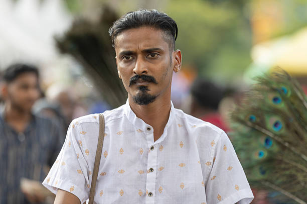 01 February 2026, George Town - Penang Island.Young Tamil man is walking on the festival area, Thaipusam Festival 2026.