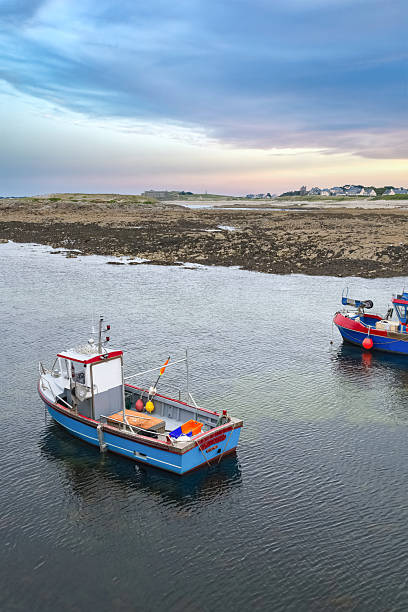 Carnac in Brittany, near the gulf of Morbihan, traditional harbor and beach, stormy weather