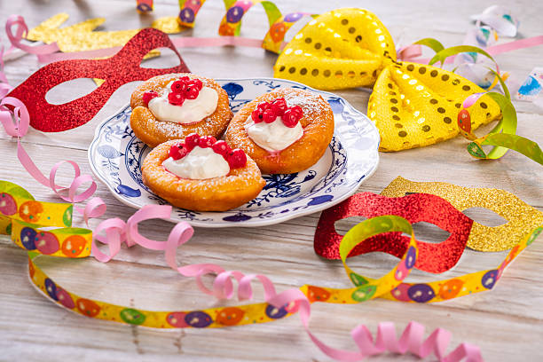 Bavarian donuts with cream and red currants for carnival and fasching
