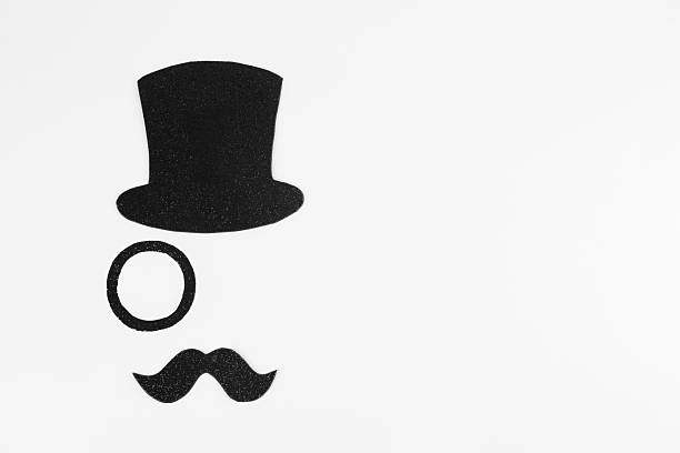 Fake mustache, hat and monocle on white background, top view. Space for text