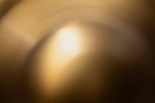 Abstract golden background of metal surface texture for modern backdrop.