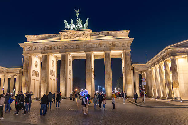 Berlin Germany - November 7, 2025:  people visit brandenburg gate in Berlin by night